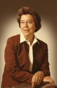 Portrait of Mary McKee Felton, who wears a brown blazer over a white collared shirt and looks off to her right.