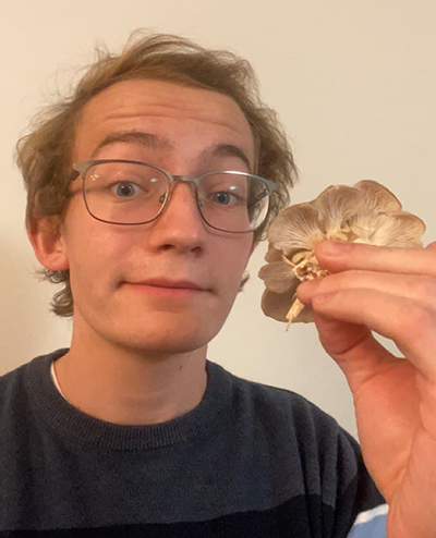 Dan Meyers pictured with a oyster mushroom (Pleurotus eryngii).