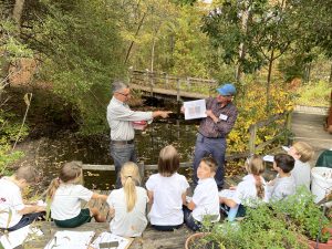 Two Garden Guides lead a school field trip in the Coastal Plain Habitat